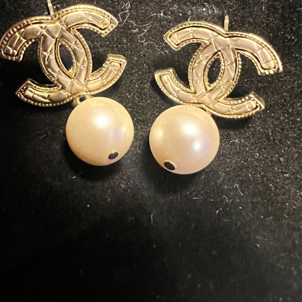 Chanel faux pearl earrings.